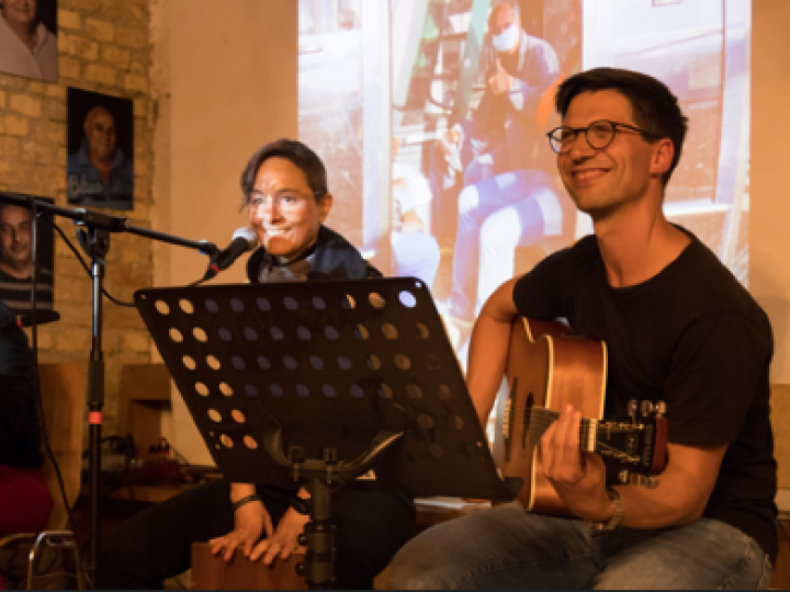 Two camp participants playing music