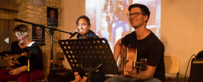 Two camp participants playing music