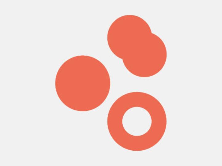 Grafisches Gestaltungselement: Mehrere orangefarbene Kreise auf neutralem Hintergrund.